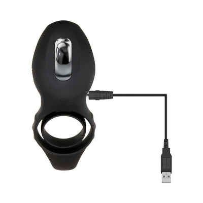 Black silicone vibrating cock ring with chrome detail, shown with USB charging cable attached.