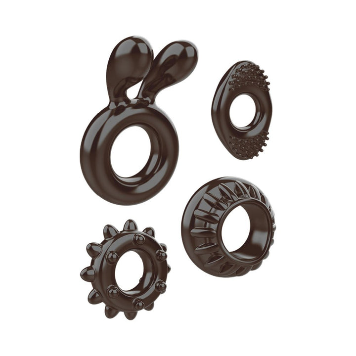 Set of four black textured cock rings including classic, bunny ears, spiked, and nubby designs made from stretchy material.