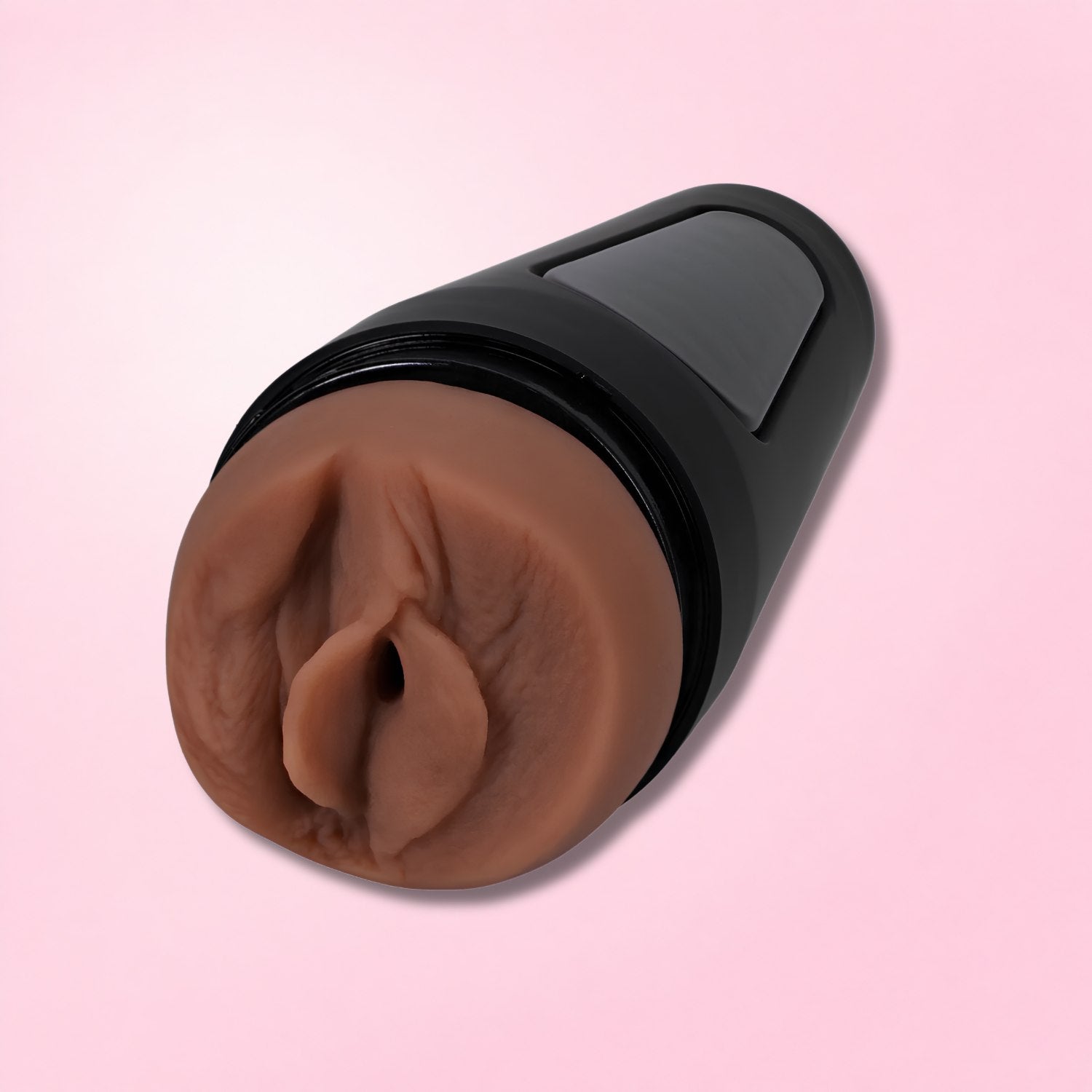 Realistic fleshlight masturbator with black case displayed next to woman in beige lingerie.