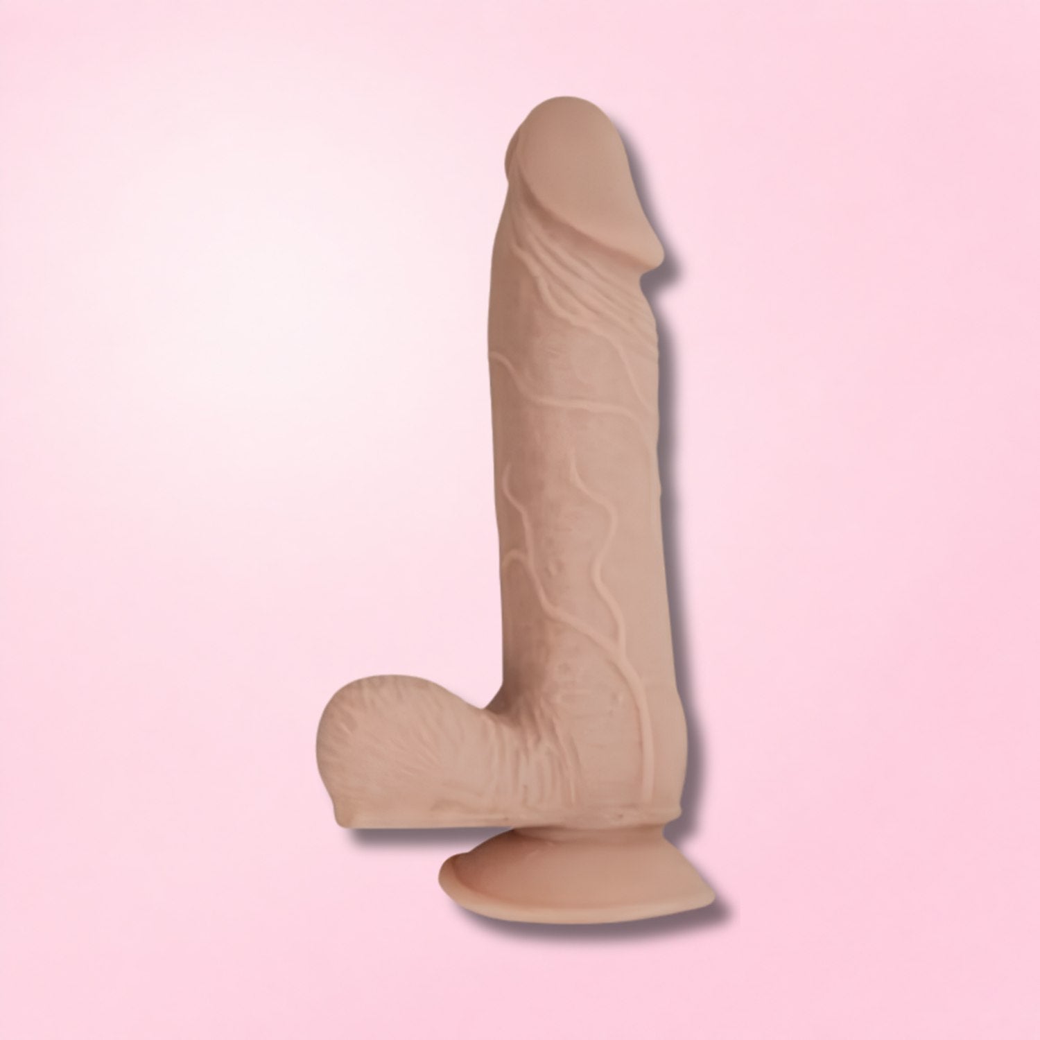 Three realistic dildos in varying skin tones with suction cup bases against a blue smoky background.