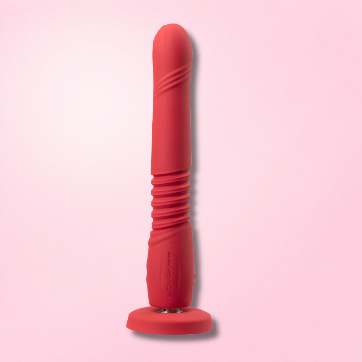 Realistic flesh-toned thrusting dildo with suction base and remote control for customizable hands-free pleasure.